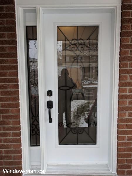 Single entry insulated steel exterior front door with side lite. White door. Blackburn classic decorative iron glass insert